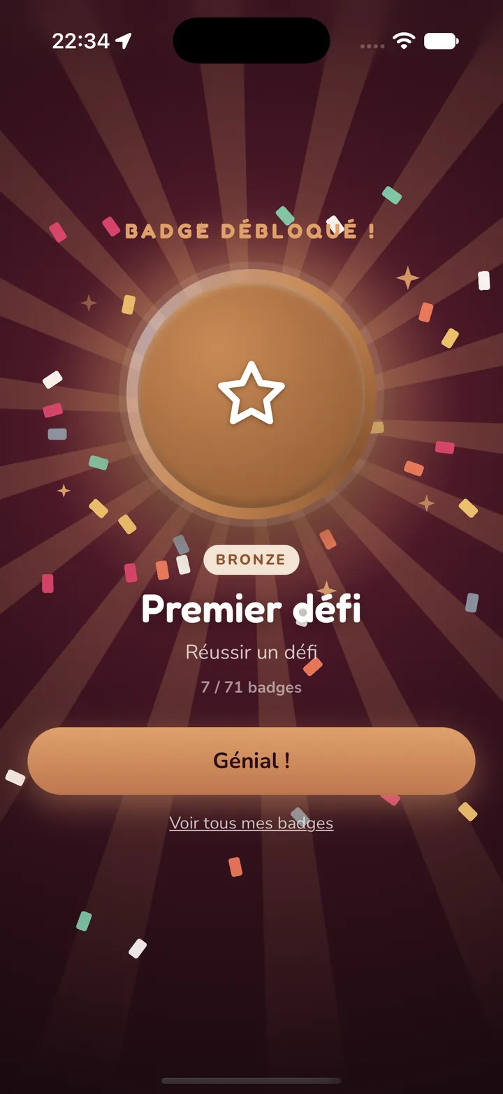 Écran de victoire : le badge gagné avec des étoiles, façon jeu vidéo